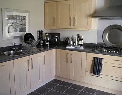 Trevor’s fitted kitchen with timber cabinet doors and dark worktops